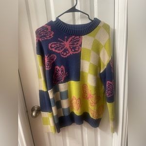 oversized butterfly and checkered sweater